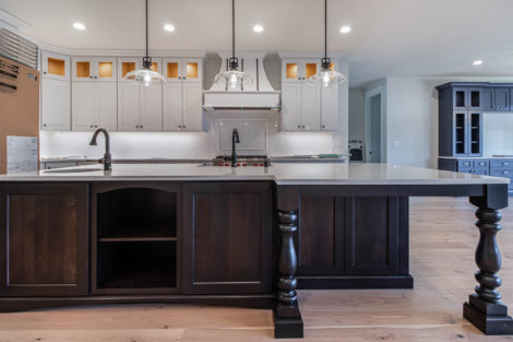 Heights at Pleasant Valley Lot 48 Kitchen with large island, custom wood cabinets with lighting, stainless steel appliances