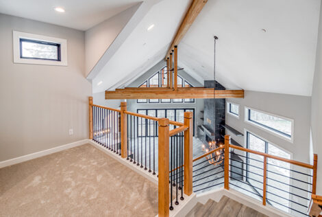 Pinnacle Lot 8 custom build by Glavin Homes upstairs loft overlooking vaulted great room