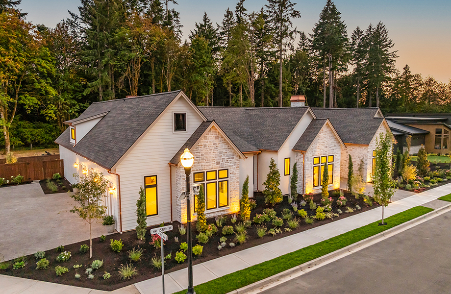 High-angle dusk photo of The Copper Hearth estate, a flagship luxury home built for the 2026 GRO Parade of Homes at Emerald Grove.